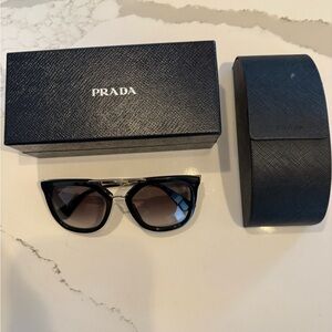 Prada Black Cat-Eye Sunglasses with Gold Bridge
Includes original Prada box